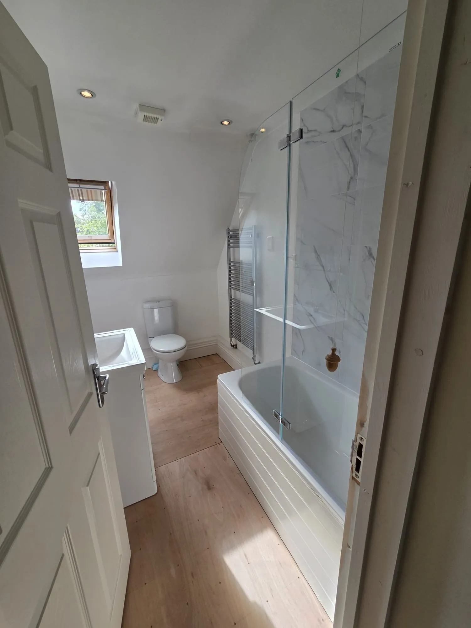 New bathroom suite with basin unit, WC and heated towel rail in Petersfield