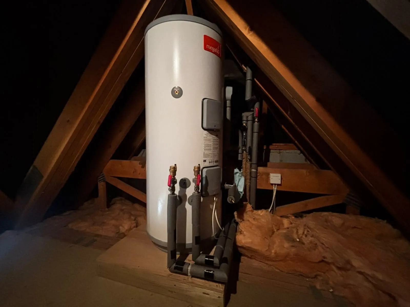 New unvented hot water cylinder and copper pipework in a Petersfield loft